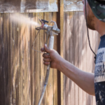 Professional fence staining in Fort Worth by Texas Patio and Fence Co. using weather-resistant stain to protect wood from sun and rain.