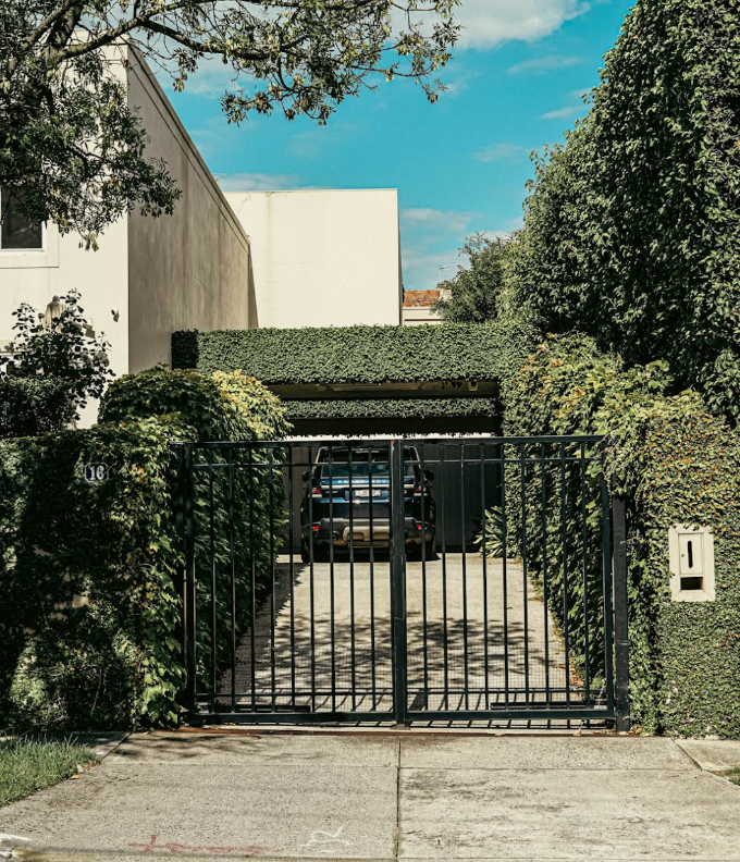 Black driveway gate boosting security and property value in Texas