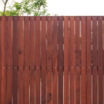Wood driveway gate requiring regular maintenance for long lifespan in Texas
