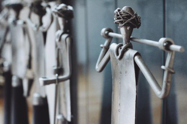 Metal garden sculpture inspiration for Aledo outdoor spaces featuring custom stone and brick design elements.