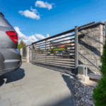 Weather-resistant electric gate for Texas homes by Texas Patio and Fence