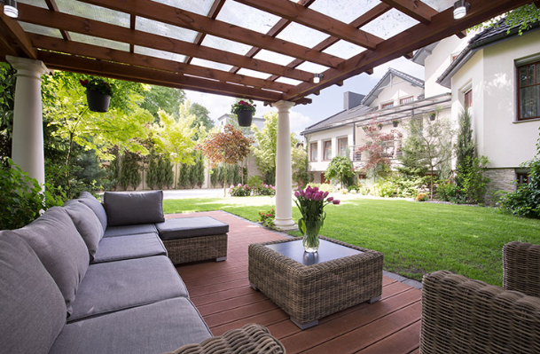 covered patio with outdoor seating overlooking a landscaped backyard in fort worth