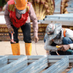 construction workers assembling metal patio framing in fort worth