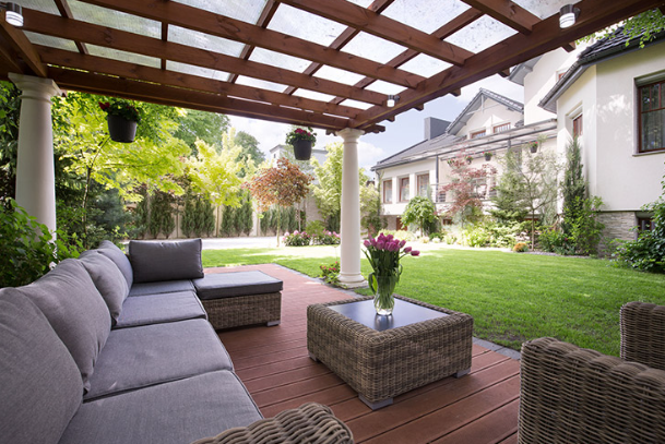 Backyard pergola providing shade and comfortable outdoor living space