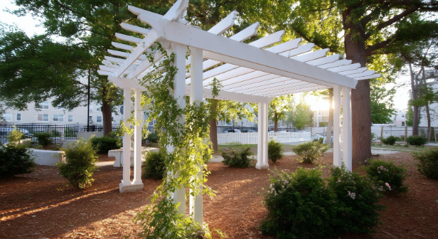 White custom arbor enhancing a landscaped Fort Worth outdoor space