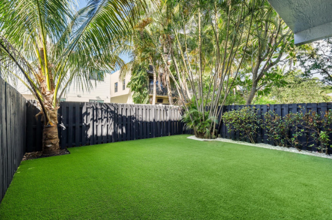 Custom synthetic turf lawn designed for a modern, low-maintenance backyard landscape